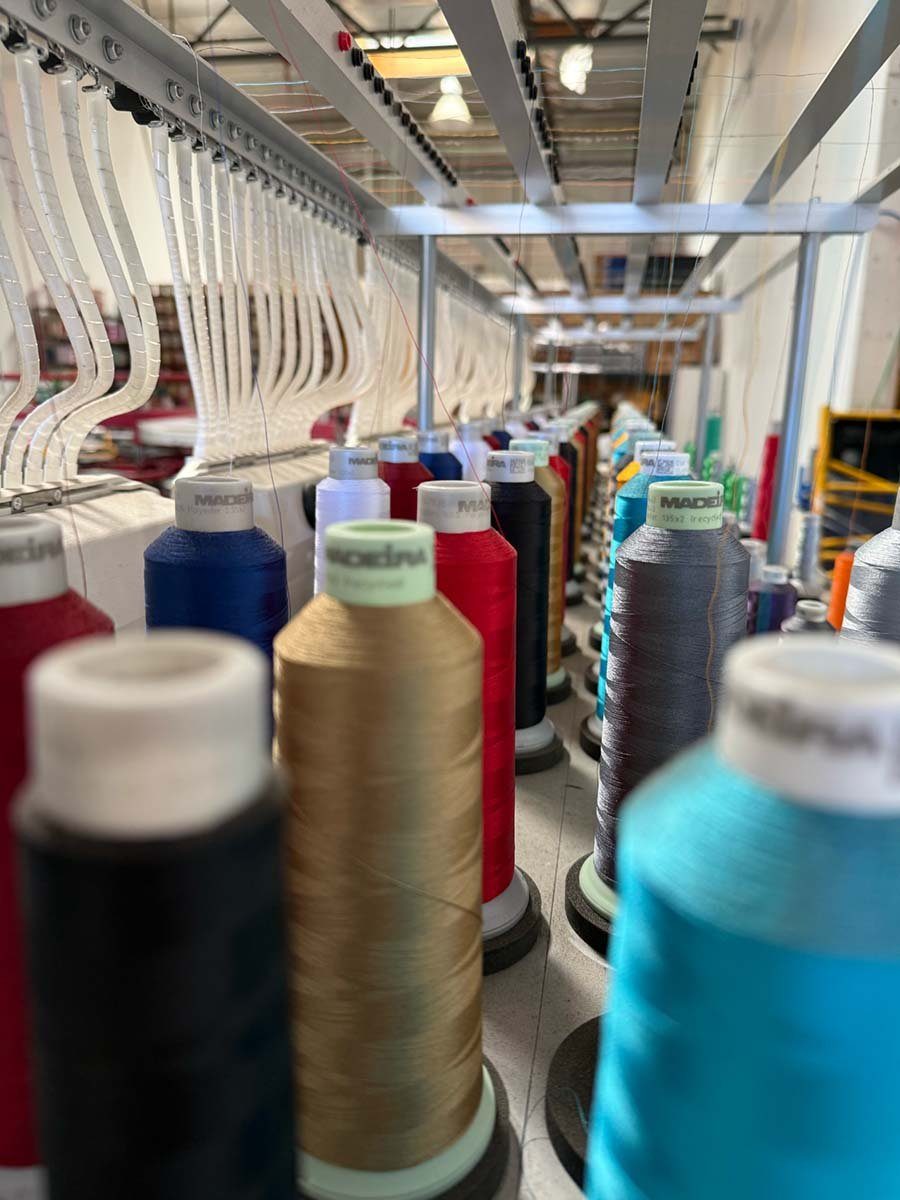 Rack of embroidery thread cones at the Kinetic Print Co shop