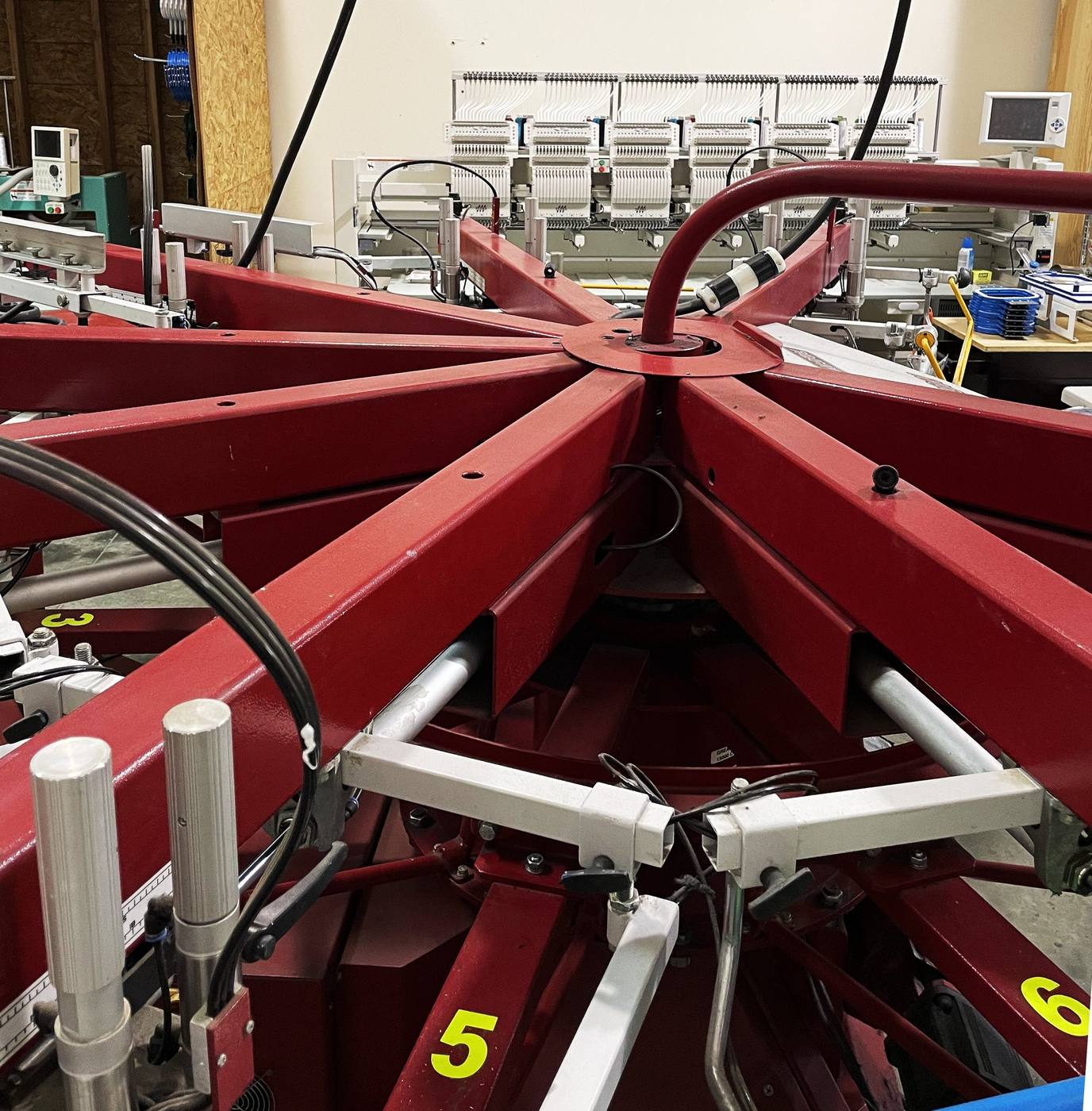 Automatic screen printing press at the Kinetic Print Co shop in Claremont