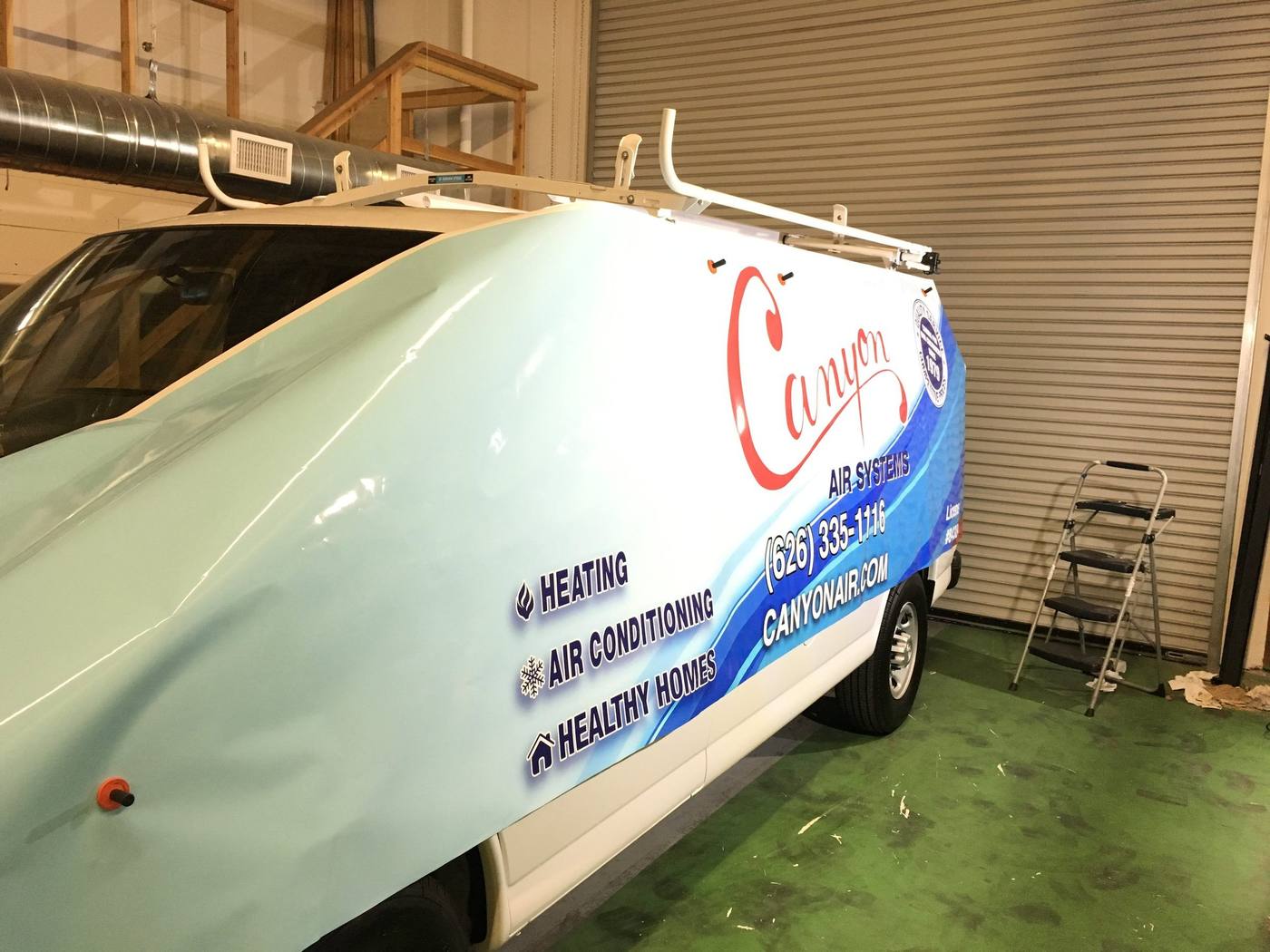 Canyon Air Services van with a full colour vehicle wrap, side view