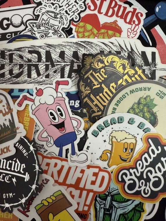 Collection of custom die-cut vinyl stickers printed for local brands